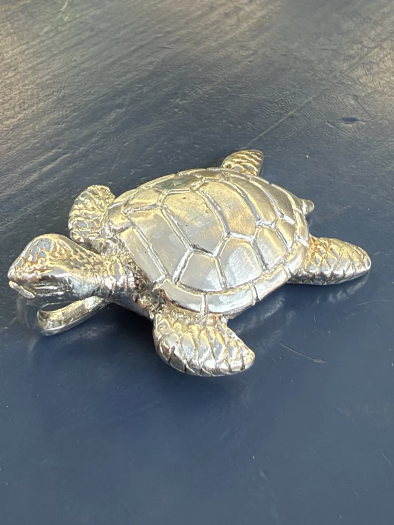 Turtle pendant on the workbench — original photograph